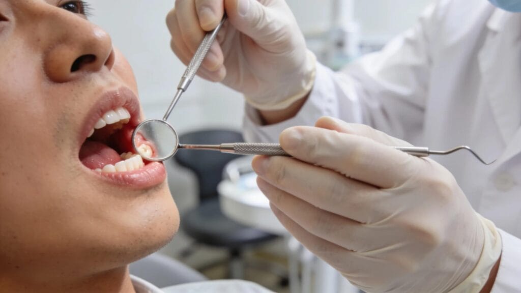 Dentist examining patient's gums, highlighting the importance of early detection of gum disease